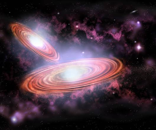 I lampi cosmici che anticipano lo scontro tra due buchi neri