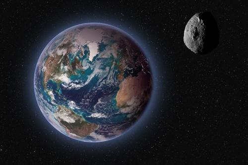 asteroide che si avvicina al pianeta Terra