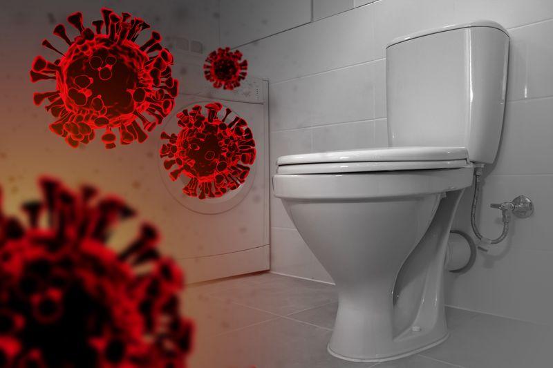 Toilette con particelle di virus rosse renderizzate a sinistra