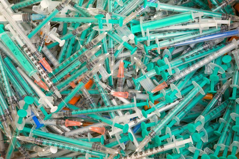 Pile of disposable syringes