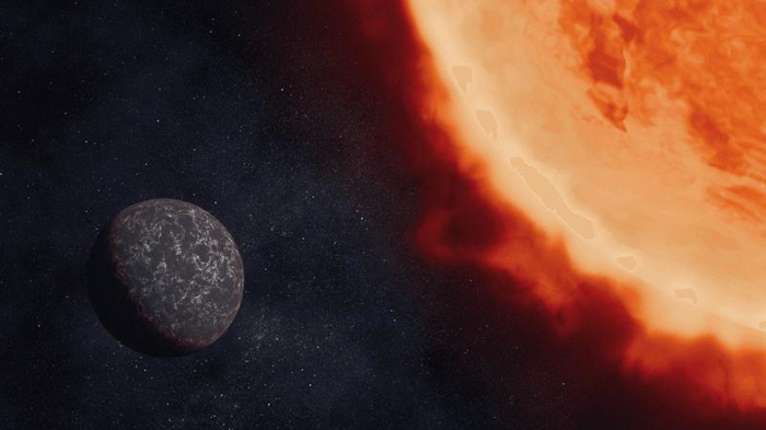 Illustrazione che mostra come potrebbe apparire l'exoplanet LHS 3844 b, basata sulla comprensione attuale del pianeta. Il pianeta è un mondo roccioso scuro e le stelle si avvicinano terribilmente