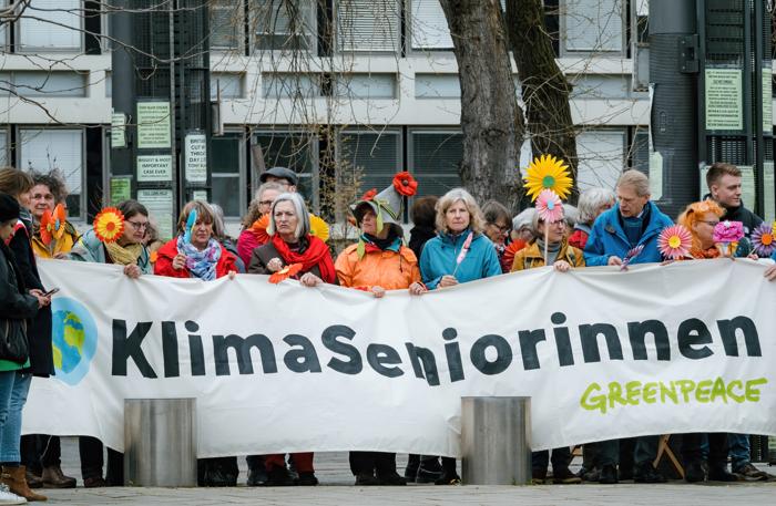 Strasbourg, France - Mar 29, 2023: A group of Swiss seniors protesting in front of European Court of Human Rights against their government which is not acting quickly enough on climate change