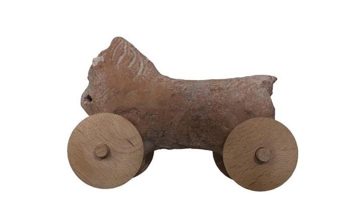 ancient-clay-horse-toy-with-wheels-on-white-background-m-1.jpg