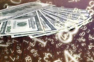100-dollar bills laid out on a table with lots of glowing numbers floating about over the top, some upside down