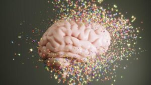 Cubetti multicolori che si dissolvono volando verso il cervello umano