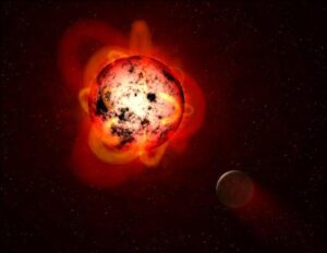 Un'illustrazione di una stella nana rossa e di un pianeta vicino
