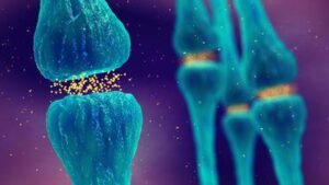Illustrazione 3D di sinapsi blu con neurotrasmettitori gialli che attraversano la fessura sinaptica su uno sfondo viola
