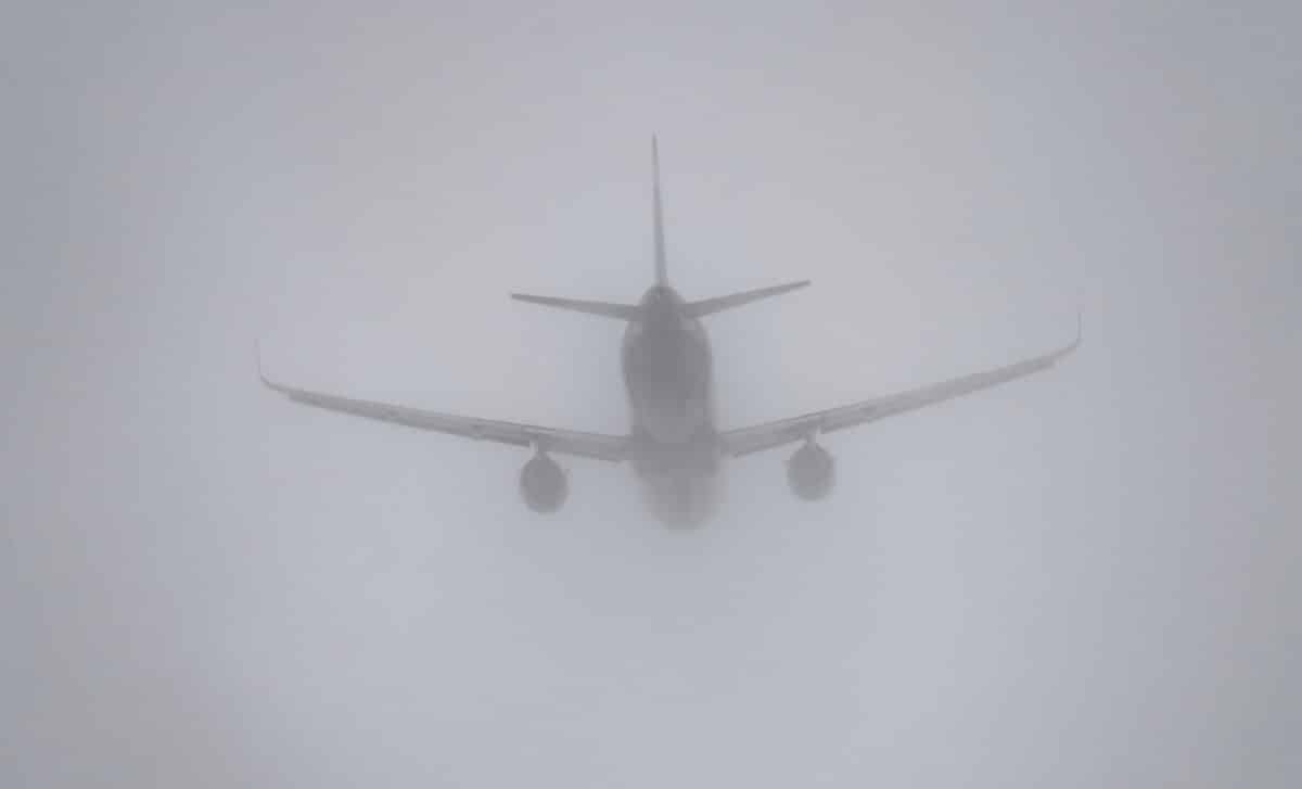 a-plane-is-flying-through-a-foggy-sky-scaled-1.jpg