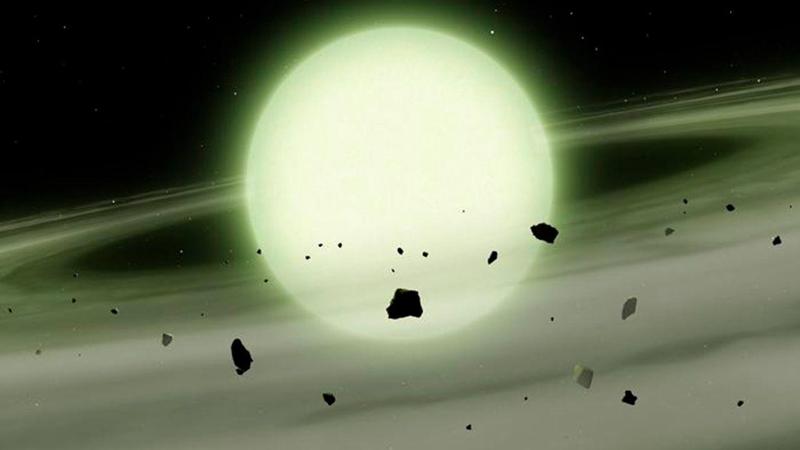 Una sfera verde luminosa al centro dello spazio profondo.